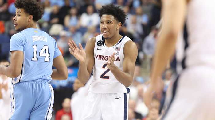 Reece Beekman claps his hands during the Virginia men's basketball game against North Carolina in the quarterfinals of the ACC Tournament at Greensboro Coliseum.